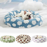 Small dog resting in a cozy and soft dog bed