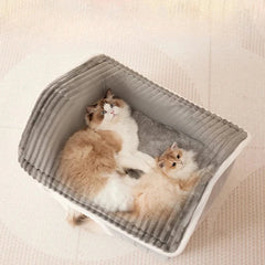 Small dog burrowing into soft pet cave dog bed for warmth