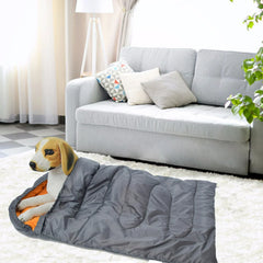 Waterproof dog bed with durable cover protecting against spills and accidents