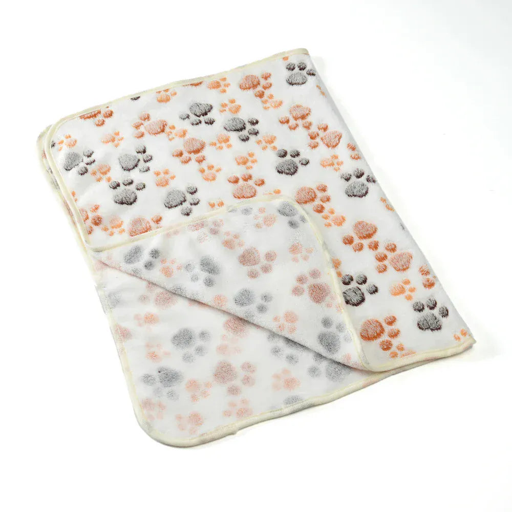 Pet blanket with non-slip backing on couch for protection